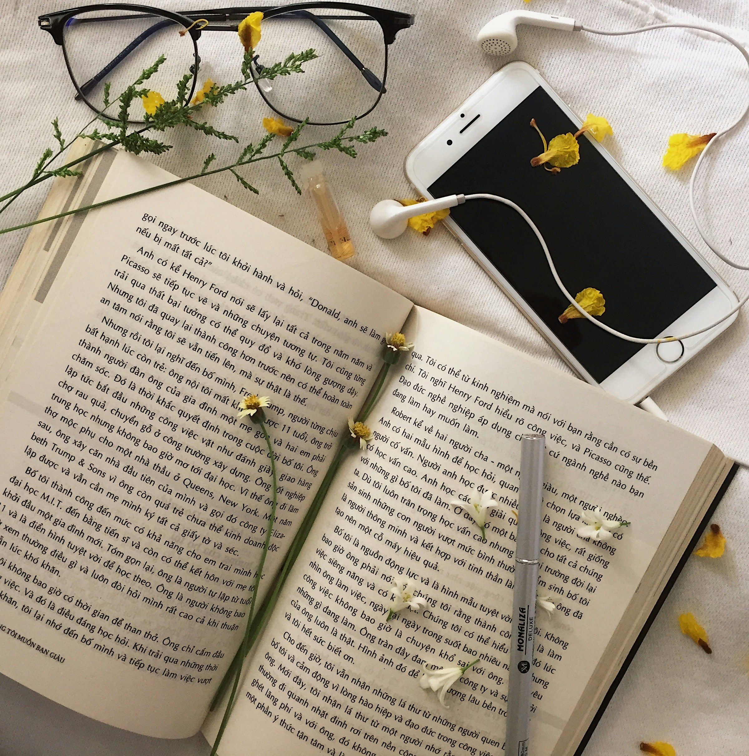 A person reading a book in a cozy setting